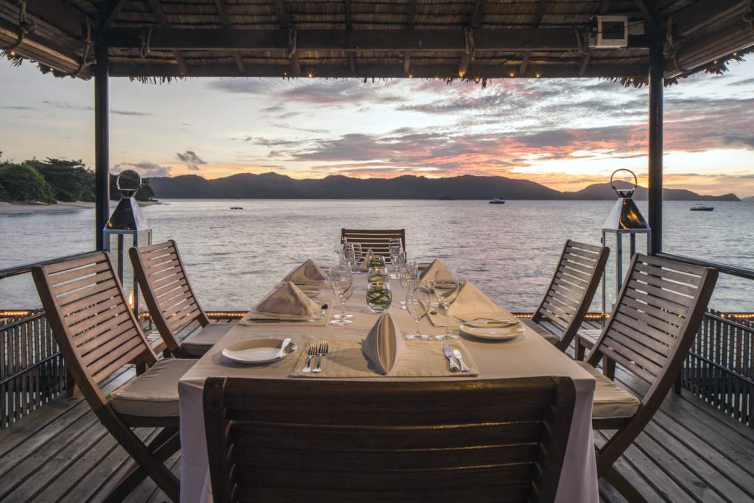 dining in front the sea on an island pier