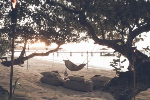 beach chillout area of canapes under a tree