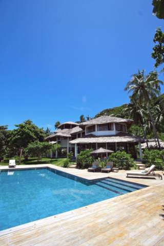 lodge and infinity pool in the midday sun