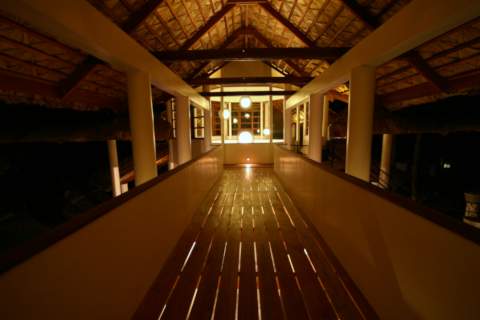 tropical lodge second floor walkway at night