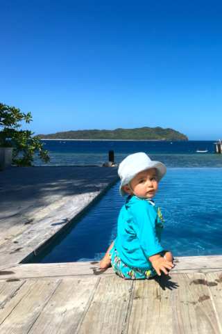 baby in infinity pool