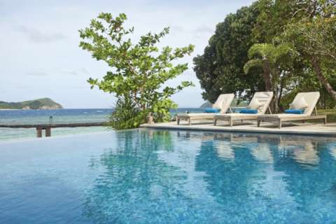 glorious blue pool on tropical island