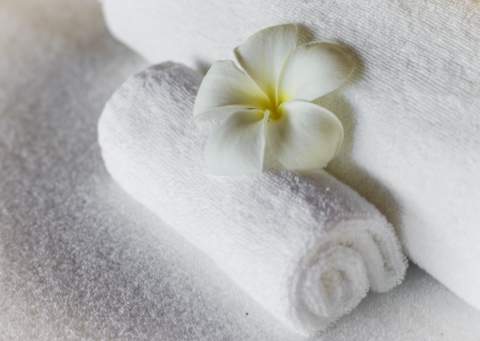 spa towels decorated by a flower